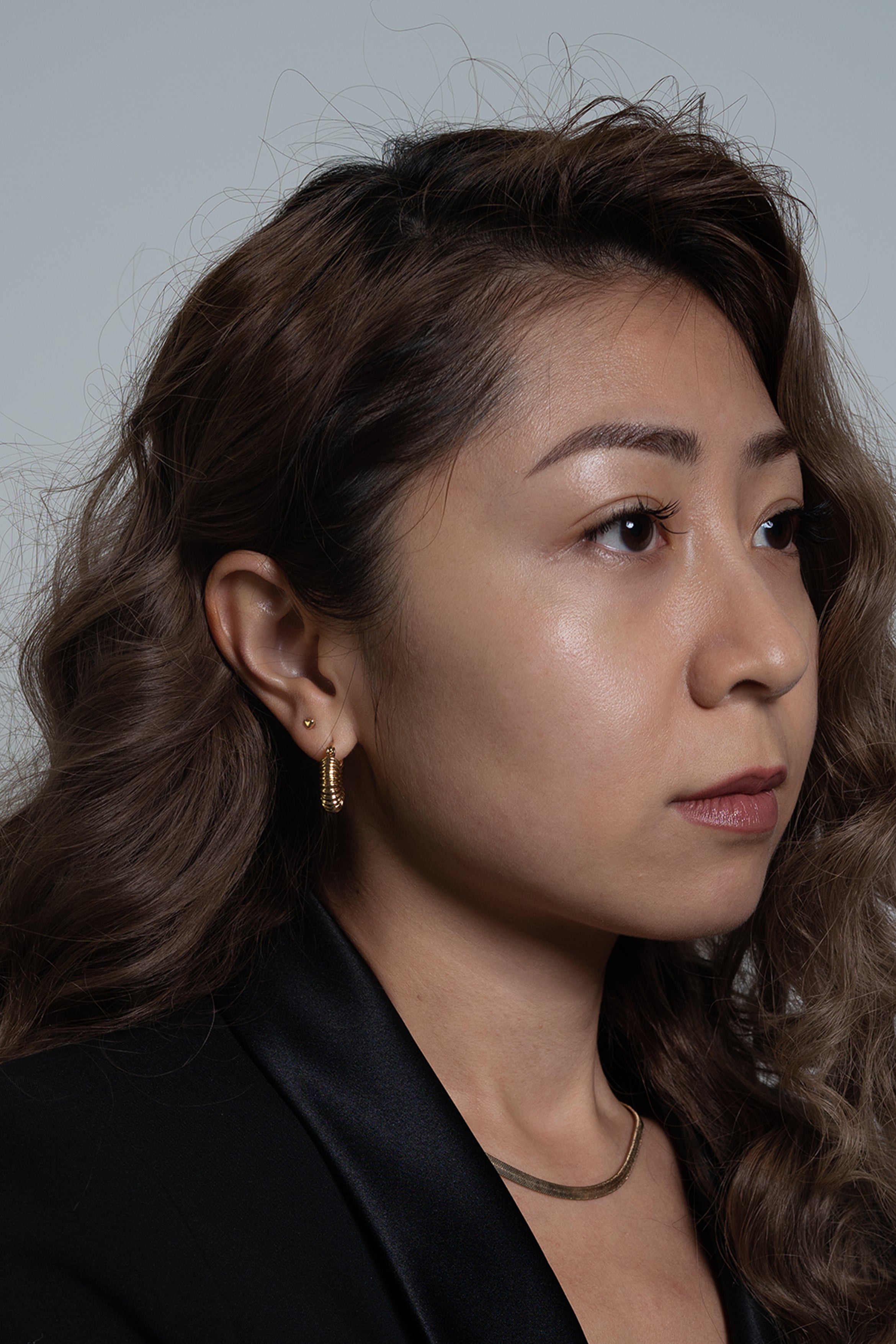 With a minimal and chic style, these small pair of hoops are the ultimate statement piece of jewelry. The fabulous and striking design of these earrings stands out alone. Wear them every day to complete your look.