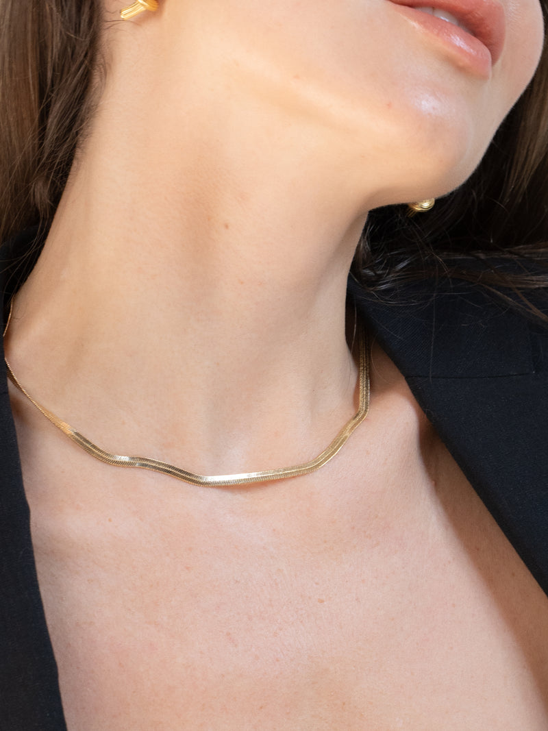 Designed with sustainability in mind, the 59th Snake Gold Chain Necklace is made of recycled material with a thick layer of 18k gold. Its classic design is sophisticated and elegant yet still minimalistic, offering a timeless look that is also extremely durable.  Details:   Made in 18K Gold Filled  Length 44cm (18")  Width 5mm  About 8g  Thick Layer  Hypoallergenic