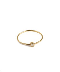 A dainty ring with a minimalist concept that adds a glittering edge to your outfit. Believe us, it will never go out of style. The classic round design of this 14K solid gold ring embraces a delicate and posh finished. Details: Made in 14K Solid Yellow Gold With White Cubic Zirconia Size 5.6.7.8 Hypoallergenic Fine Jewelry. miramira New York