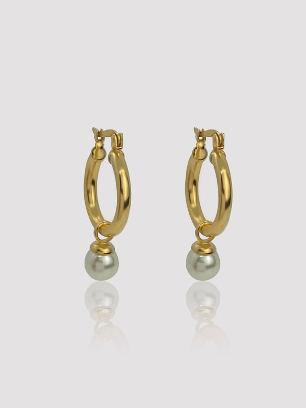 Add a sense of charm and beauty to your look when you wear the Bedford 18K Gold Filled hoops. The freshwater pearl along with the luscious gold texture will create such a unique design. Each pearl is sightly different in color and shape due to its natural origin.  Details:  18K Gold Filled  Freshwater Pearl  About 3g/pair  Hypoallergenic