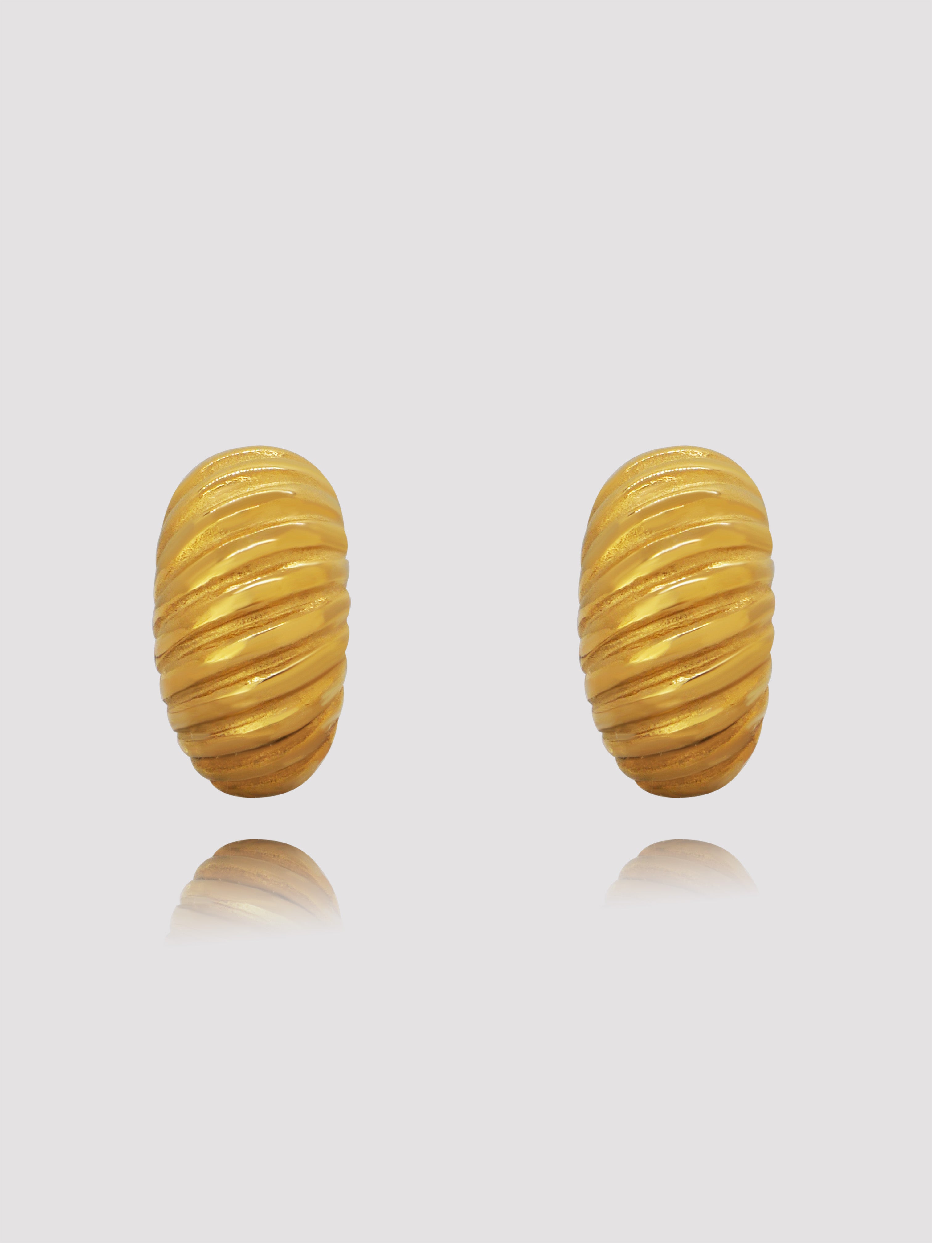 Your new favorite Parisian pair of hoops designed with a push-back closure. These earrings will be perfect for any occasion. Large enough to make a statement when you run errands across the city, grab a coffee with your bestie, or go on a date with your love. You're certain to pull this pair out again and again.   Details:  18K Gold Plated on Stainless Steel  Made in Stainless Steel  Length 2.5cm - Width 2.5cm  Diameter Width 20mm  Weight about 17g/pair  Hypoallergenic