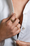 A vintage design with a touch of minimalism. It's a rare and one of a kind piece. The Elizabeth gold ring has the feeling of an heirloom passing down from generation to generation. It is meaningful and precious to those who wear it. 