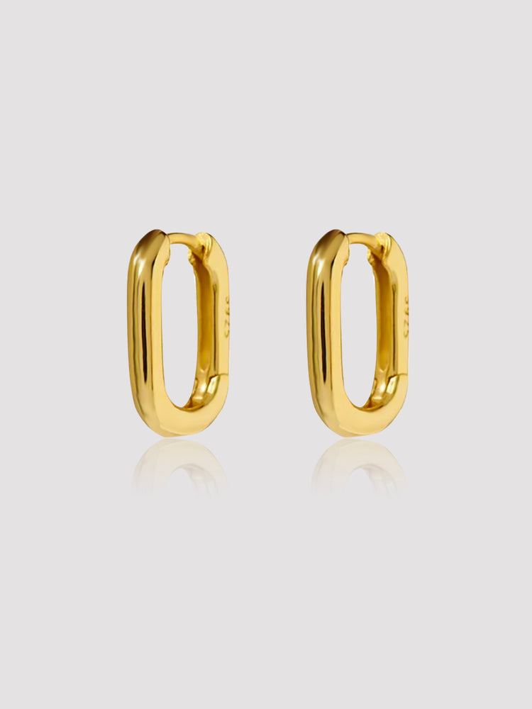 We know you got a busy Friday ahead of you, and you are looking to look flawless for work, errands, or sushi dinner. The Mini Lexington Hoops will elevate any style you choose to dress up. With a contemporary minimalist design, these oval-shaped earrings are perfect to wear alone or stacked. Available in both Gold and Silver colors.  Details:  18K Gold Plated on Silver  Made in Gold Vermeil  S 925 Sterling  L 1.5cm - W 1cm  About 2g/pair  Hypoallergenic. miramira New York