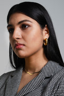 With the semi-square design, these elegant simple gold hoops are perfect for a night out with your friends. A staple piece to your jewelry collection. These classic pair of earrings will add instant polish to your ear game. 