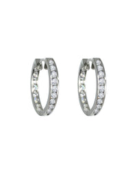 These middle-sized hoops are the perfect example of timeless elegance and of the moment jewelry. Featuring a shimmering and dainty style of pave setting. The Plaza Hoops will be the star that never goes out. These earrings are available in a smaller size.   Details:   Made in 14K Solid Yellow Gold With White Cubic Zirconia  Dimensions: L 1.8cm - W 1.8cm  Color: 14K Solid Yellow Gold / 14K Solid White Gold  Hypoallergenic   Fine Jewelry. miramira New York