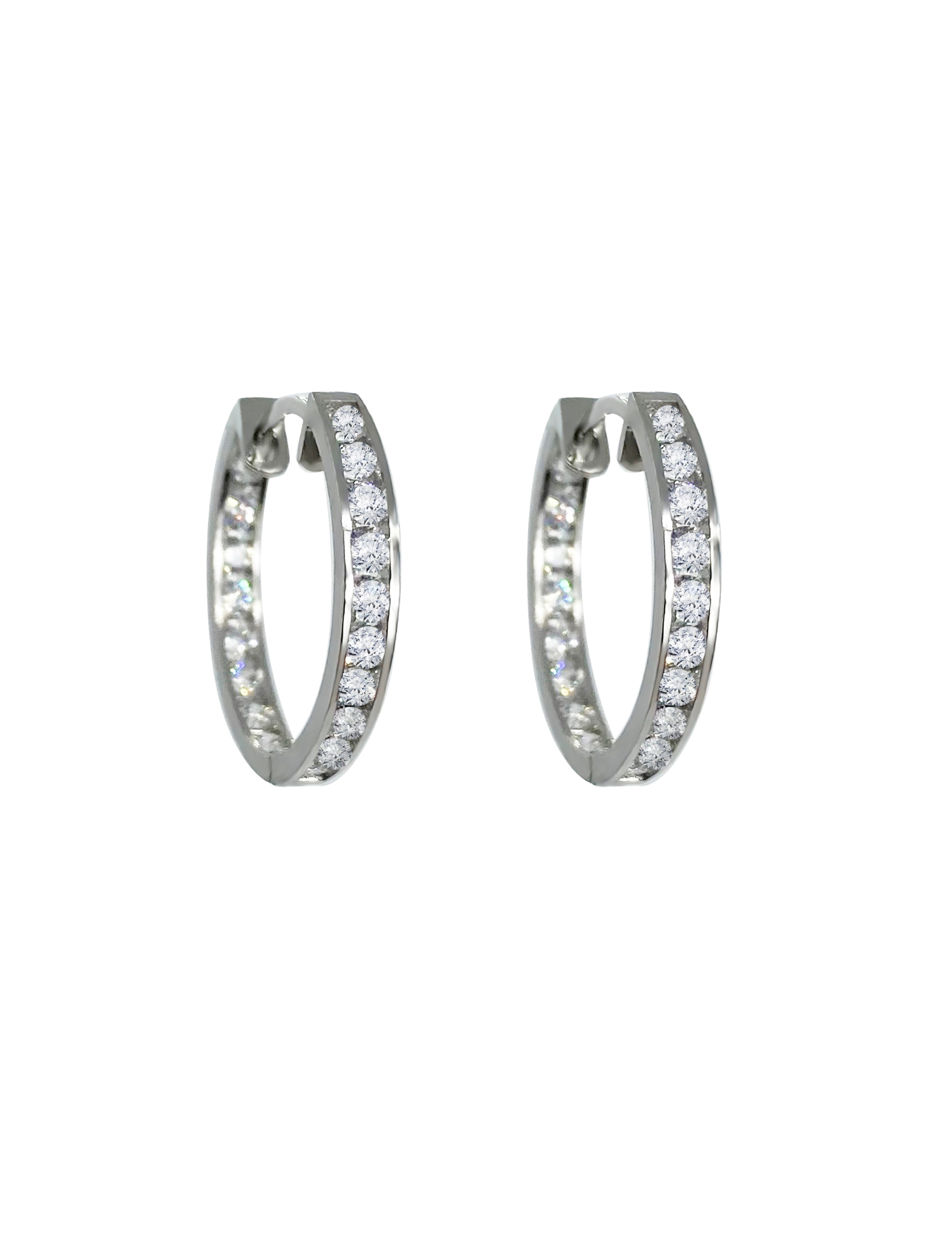 These middle-sized hoops are the perfect example of timeless elegance and of the moment jewelry. Featuring a shimmering and dainty style of pave setting. The Plaza Hoops will be the star that never goes out. These earrings are available in a smaller size.   Details:   Made in 14K Solid Yellow Gold With White Cubic Zirconia  Dimensions: L 1.8cm - W 1.8cm  Color: 14K Solid Yellow Gold / 14K Solid White Gold  Hypoallergenic   Fine Jewelry. miramira New York