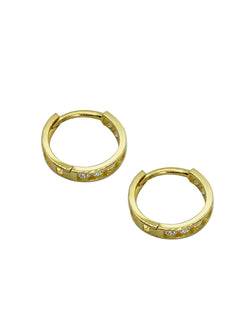 These small hoops are the perfect example of timeless elegance and of the moment jewelry. Featuring a shimmering and dainty style of pave setting. The Plaza Hoops will be the star that never goes out. These earrings are available in a medium size as well.    Details:  Made in 14K Solid Yellow Gold With White Cubic Zirconia  Dimensions: L 1.3cm - W 1.3cm  Color: 14K Solid Yellow Gold / 14K Solid White Gold  Hypoallergenic   Fine Jewelry. miramira New York
