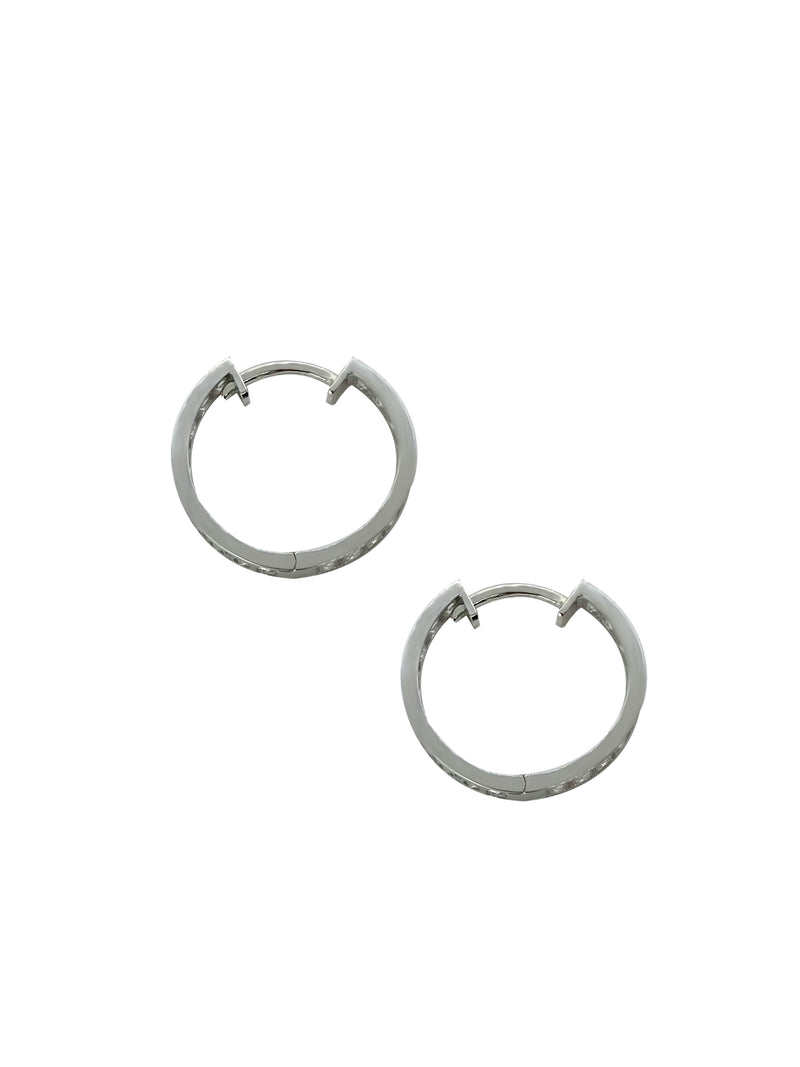 These middle-sized hoops are the perfect example of timeless elegance and of the moment jewelry. Featuring a shimmering and dainty style of pave setting. The Plaza Hoops will be the star that never goes out. These earrings are available in a smaller size.   Details:   Made in 14K Solid Yellow Gold With White Cubic Zirconia  Dimensions: L 1.8cm - W 1.8cm  Color: 14K Solid Yellow Gold / 14K Solid White Gold  Hypoallergenic   Fine Jewelry. miramira New York