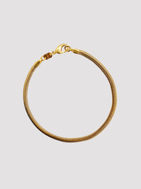 With a retro and vintage design that can take you back to the 80s and 90s. A versatile piece for layering when you stack it with other beautiful staples as well as a solid choice to wear alone. This bracelet will never tarnish with proper care. It is resistant to water or sweat, made in a thick texture of 18-karat Gold Filled.  Details:  18K Gold Filled  Length 18cm (7")  Width 4mm  Weight about 4g  Hypoallergenic